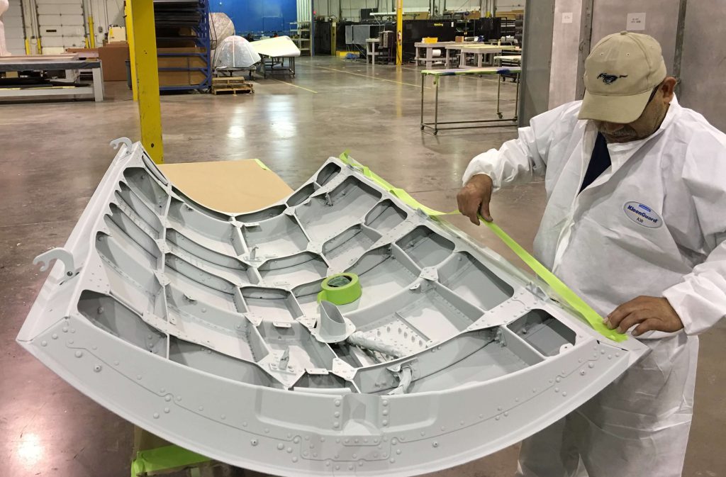 Taping interior on a B737NG APU Door before preparing the outer surface for top coats