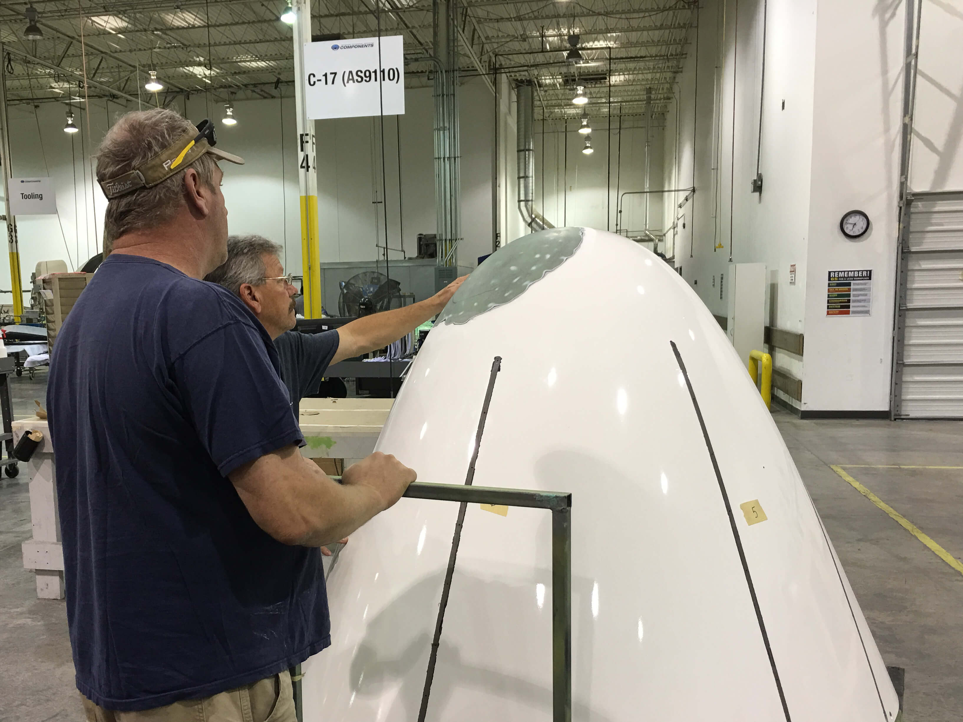 Inspecting surface of a B737 Radome before beginning repairs