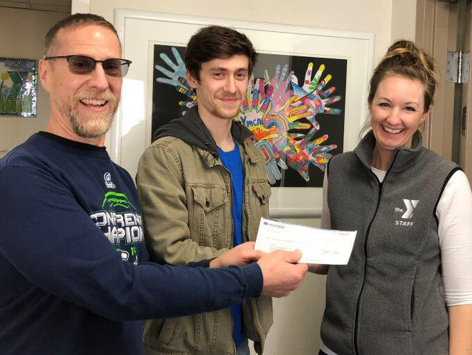 Everett Employees Gives Company Check to YMCA through the Gifts of the Heart Program That Matches Personal Volunteer Hours
