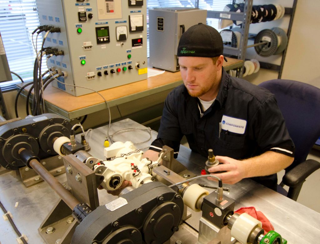 Technician performing final testing of a 767 Cargo Door Actuator to make sure all OHM/CMM requirements are met prior to return to service